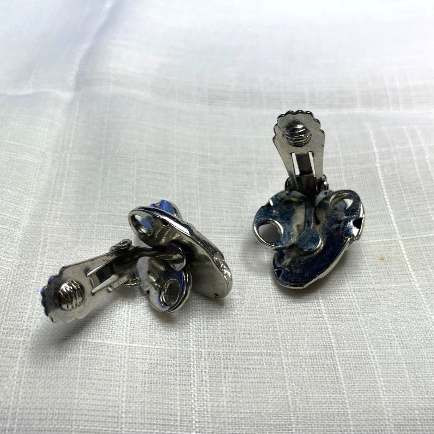 Vintage Silver-Toned Floral Clip-On Earrings With Textured Design And Elegant Detailing