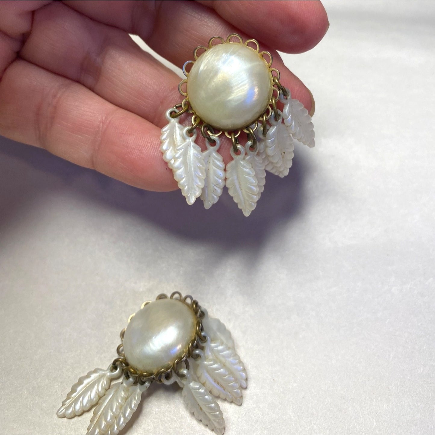 Vintage Clip-On Earrings With Mother Of Pearl Center & Dangling White Leaf Design