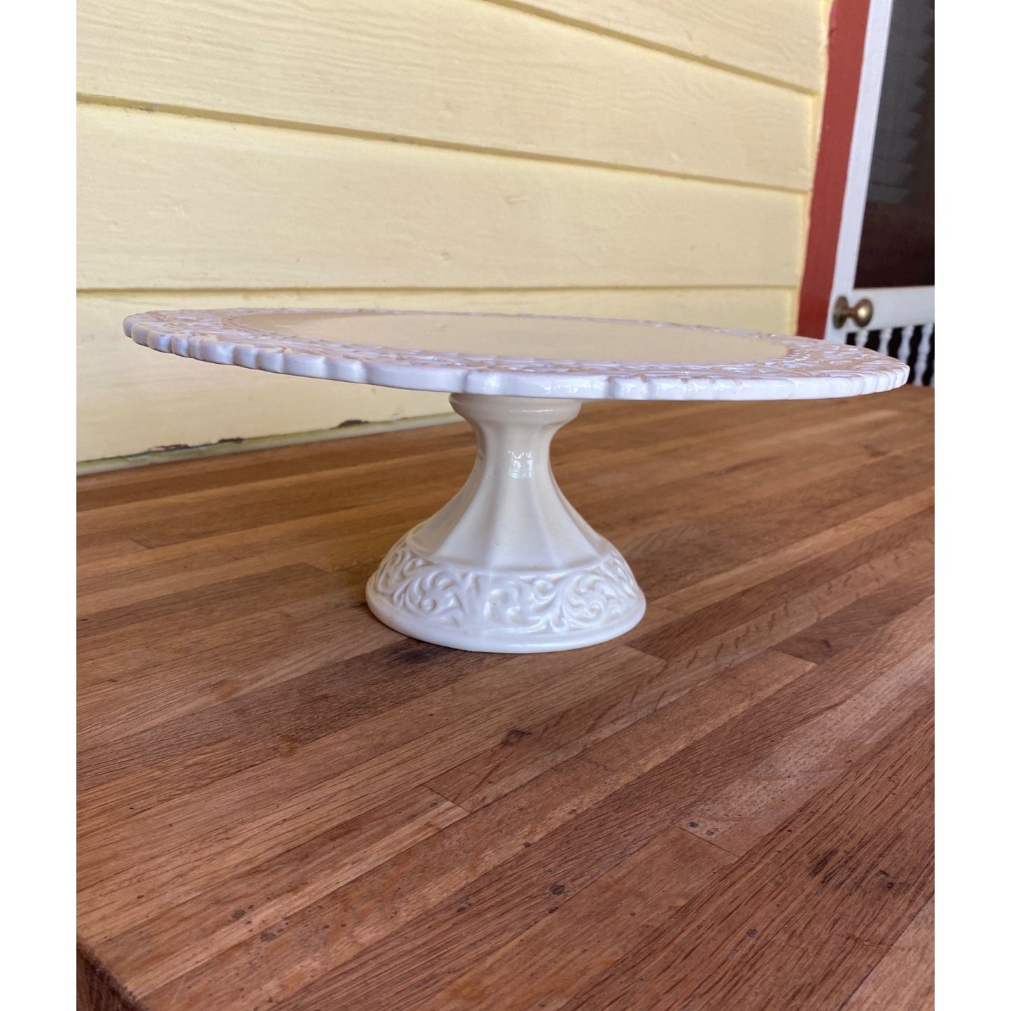 White Ceramic Pedestal Cake Stand With Ornate Scrollwork Edges Elegant Home Or Event Display Piece