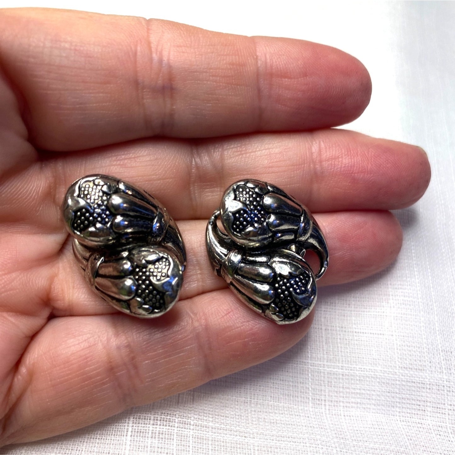Vintage Silver-Toned Floral Clip-On Earrings With Textured Design And Elegant Detailing