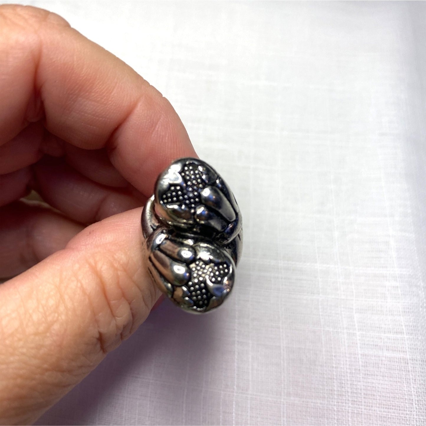 Vintage Silver-Toned Floral Clip-On Earrings With Textured Design And Elegant Detailing