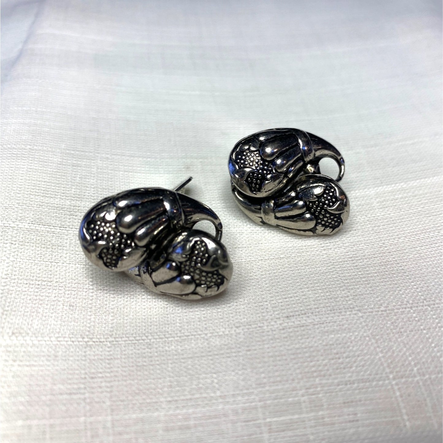 Vintage Silver-Toned Floral Clip-On Earrings With Textured Design And Elegant Detailing