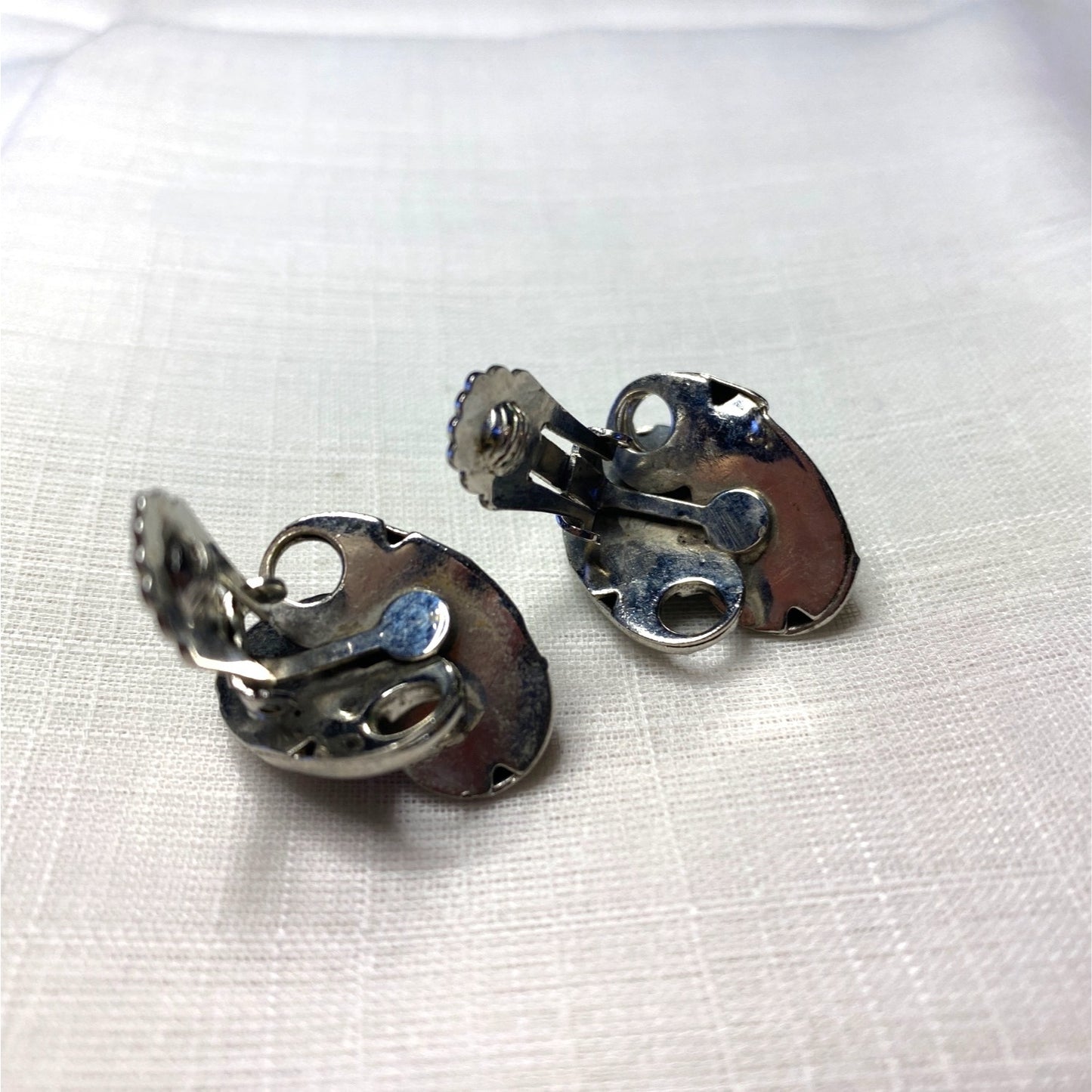 Vintage Silver-Toned Floral Clip-On Earrings With Textured Design And Elegant Detailing