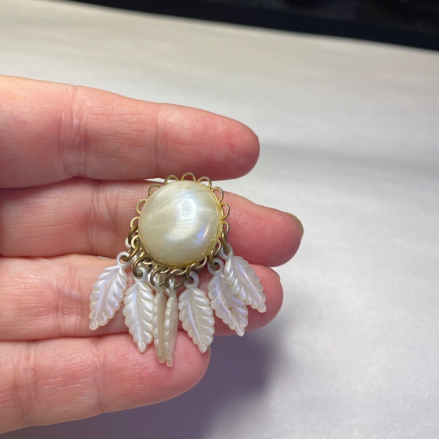Vintage Clip-On Earrings With Mother Of Pearl Center & Dangling White Leaf Design