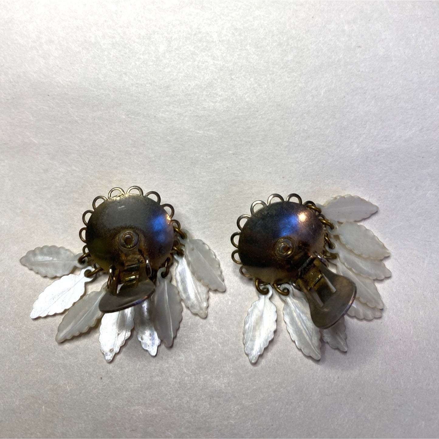 Vintage Clip-On Earrings With Mother Of Pearl Center & Dangling White Leaf Design