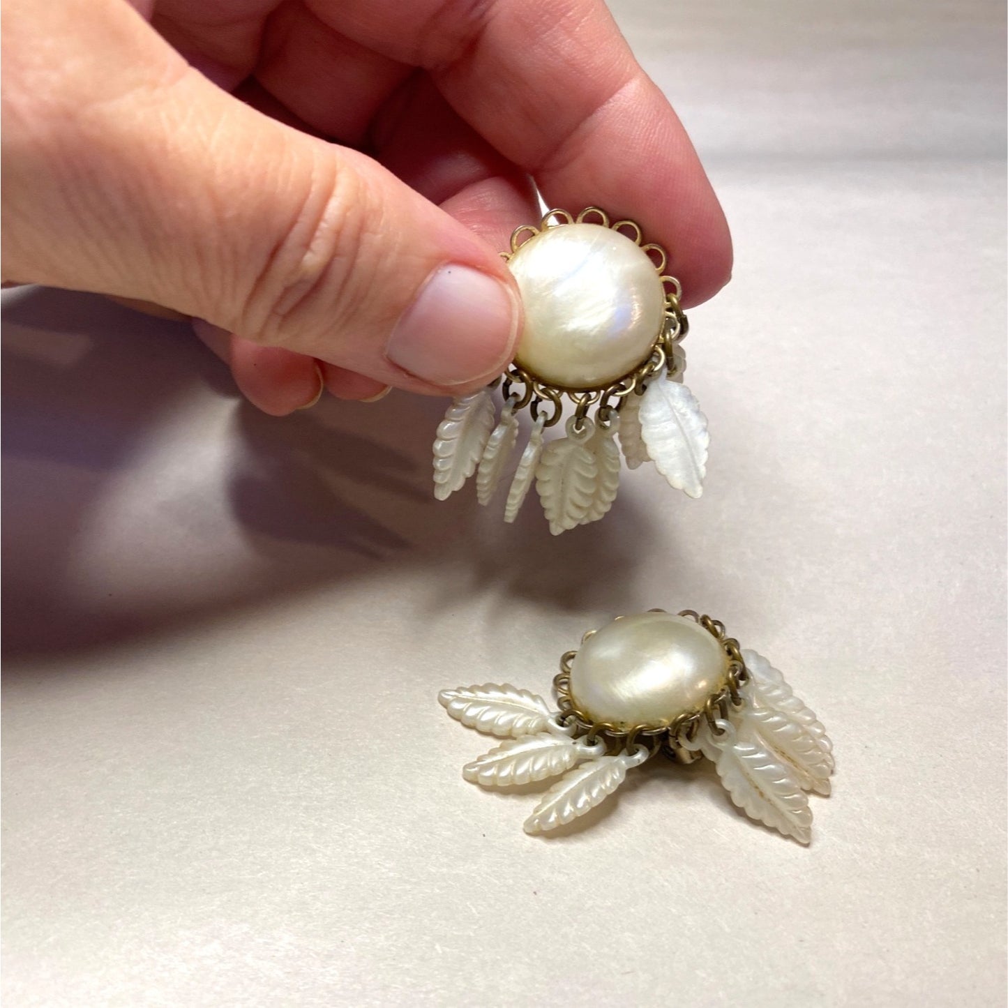Vintage Clip-On Earrings With Mother Of Pearl Center & Dangling White Leaf Design